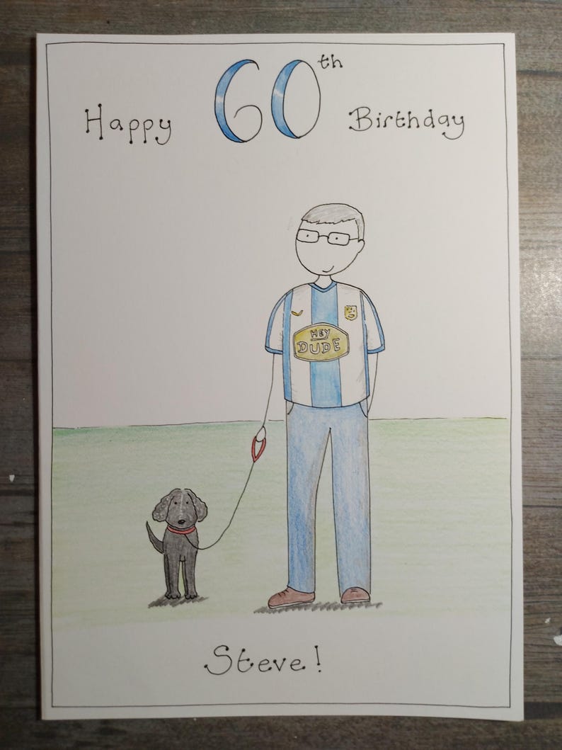 May include: Hand-drawn birthday card with the text "Happy 60th Birthday" in black and blue. The card features a cartoon illustration of a man in a jersey with a dog on a leash. The dog is black with a red collar. The name "Steve!" is written at the bottom.