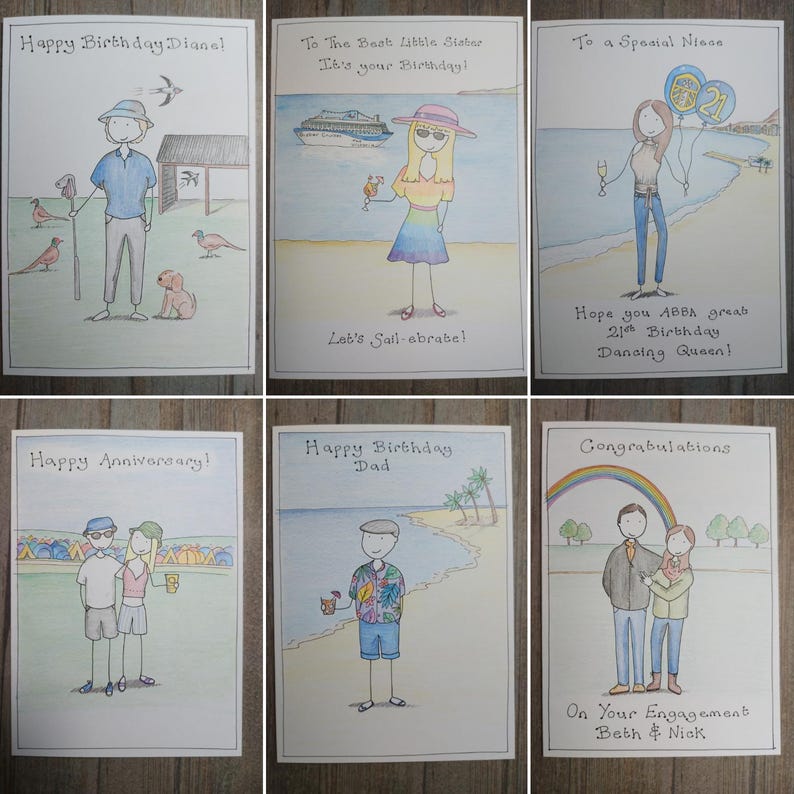 May include: A collection of six hand-drawn greeting cards with various celebratory messages. The cards feature illustrations of people, beach scenes, and text such as "Happy Birthday" and "Congratulations". The cards are on a wooden surface.