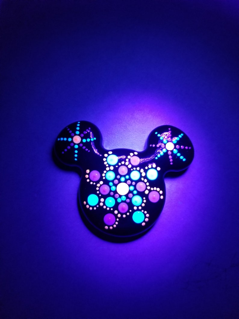 Blue Pink Purple Glow in the Dark Mickey shaped Mandala painted rock Magnet.