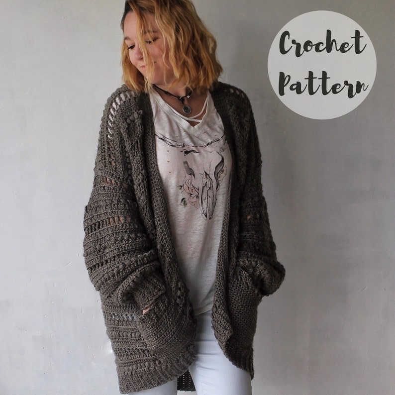 May include: A crochet cardigan pattern in a brown color. The cardigan has a loose fit and features a textured stitch pattern.