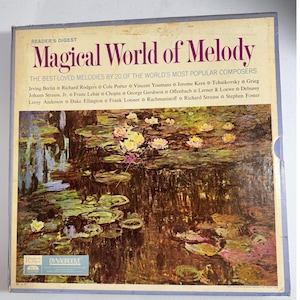 May include: A vintage Reader's Digest record album titled "Magical World of Melody." The cover features a painting of water lilies in a pond. The album lists composers like Irving Berlin and Richard Rodgers.