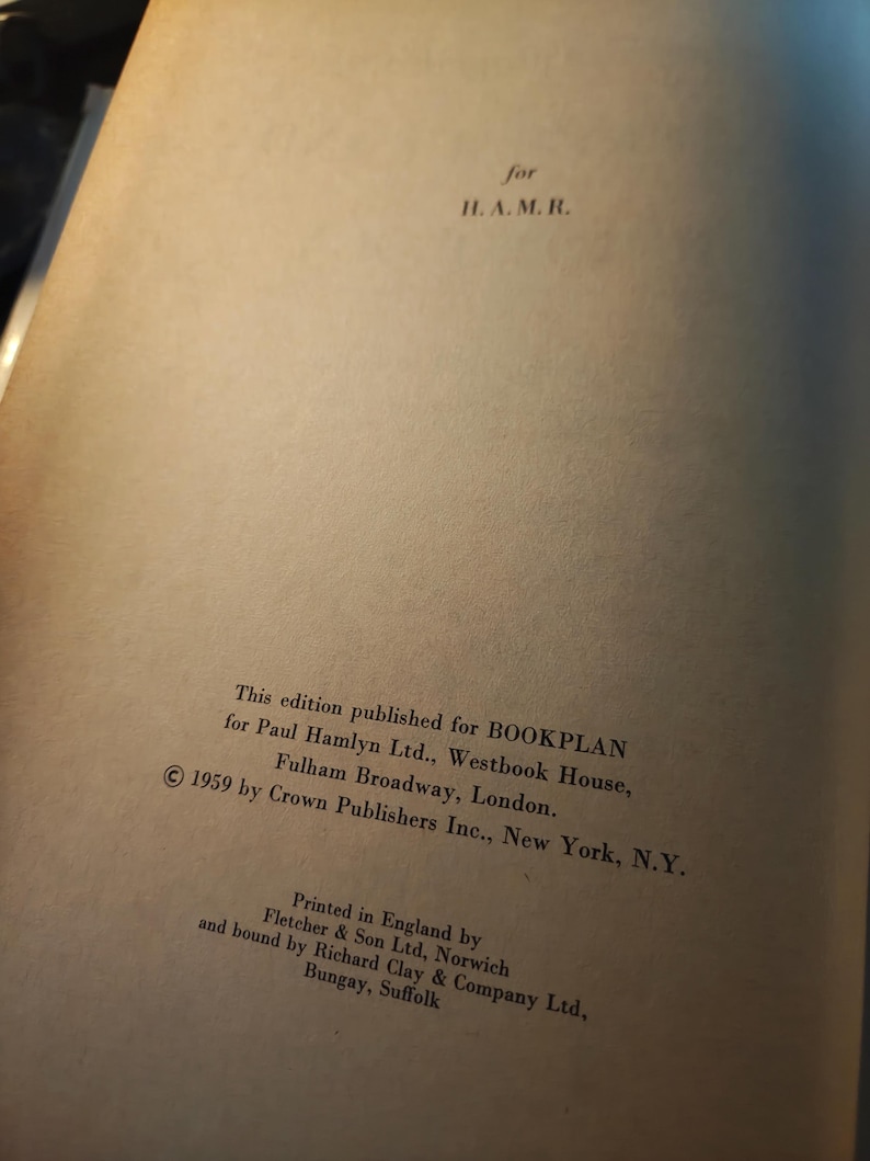 May include: Open book page with text. The text reads "for H. A. M. R." and details about the edition published for BOOKPLAN, Paul Hamlyn Ltd., and Crown Publishers Inc. The book was printed in England by Fletcher & Son Ltd. in 1959.