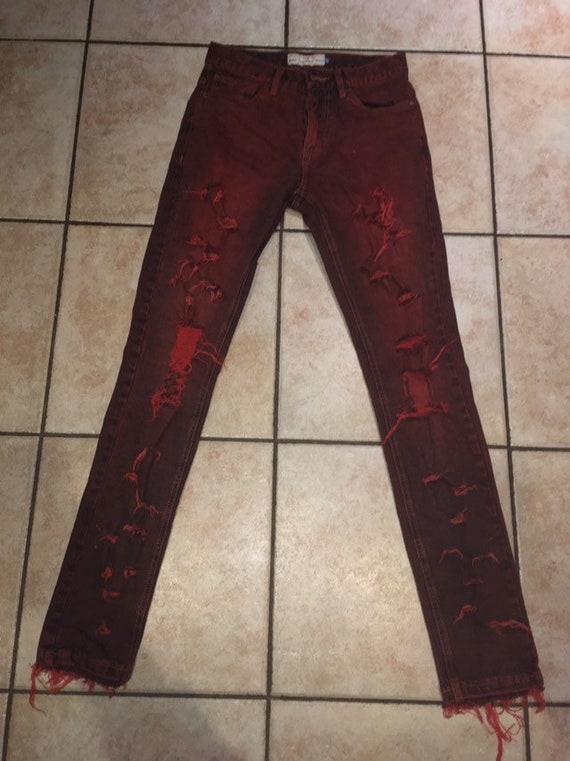 red distressed skinny jeans