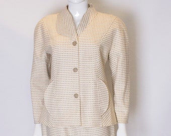 A Vintage 1980s cream Courreges Skirt Suit