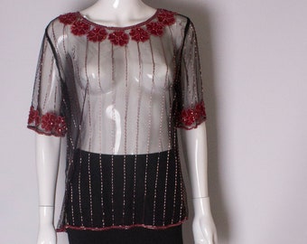 A vintage 1980s Net T Shirt with Sequin and Bead Embellishment