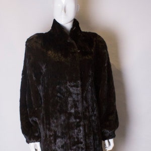 A Vintage 1980s dark brown long Glossy Mink Coat