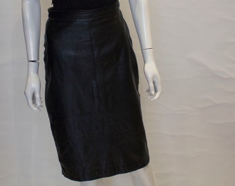 A vintage 1980s black leather pencil skirt