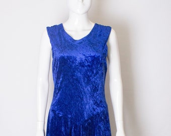 A vintage 1970s electric blue velvet party dress