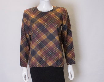 A Vintage 1980s Yves Saint Laurent striped Silk Top