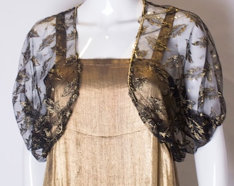 Een Vintage jaren 1970 Black netto Bolero met goud Detail