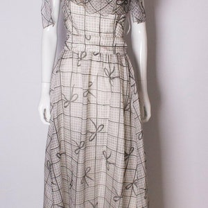 A Vintage 1970s grey printed silk evening gown by Gina Fratini image 2