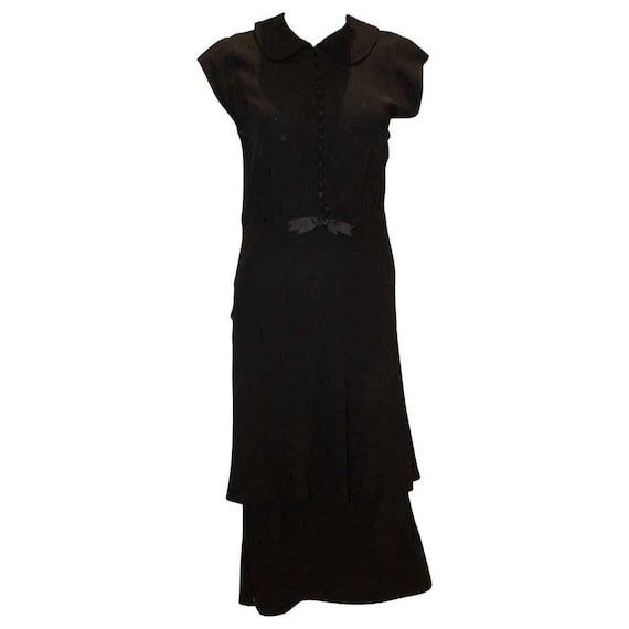 A vintage 1940s Black Cocktail Dress with Cap Slee