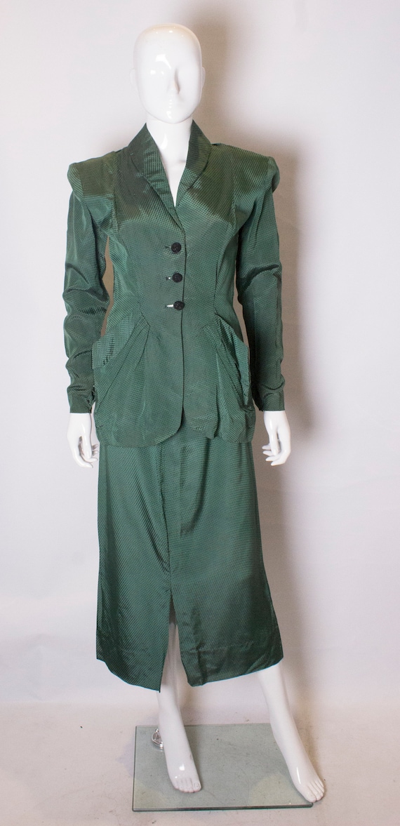A Vintage bottle green 1940s Skirt Suit