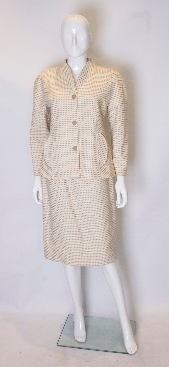 A Vintage 1980s cream Courreges Skirt Suit