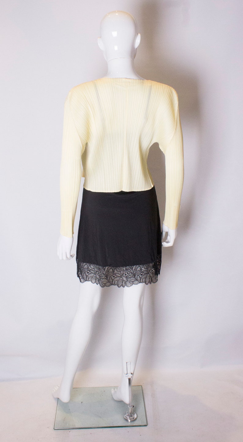 A vintage 1990s Miyake Pleats Please Yellow Cardigan Jacket