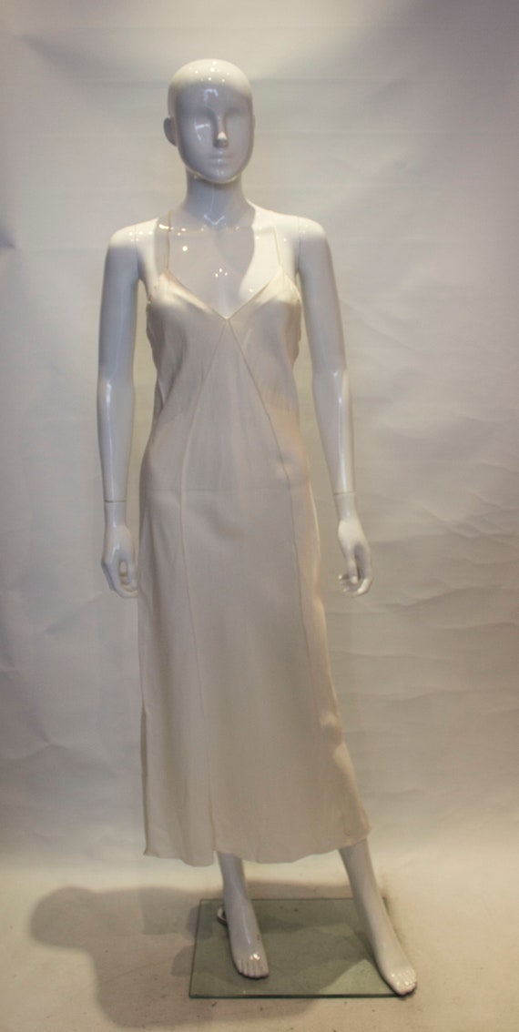 A vintage 1980s Ivory long Silk Slip night dress