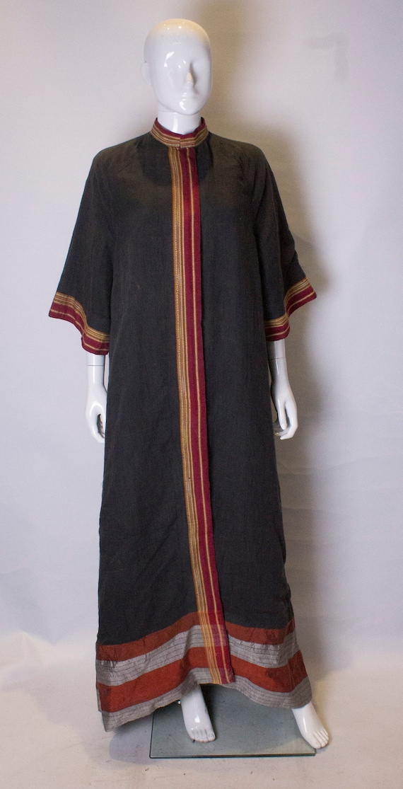 A Thea porter floor length jacket in black and str