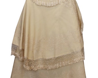 May include: A white embroidered shawl with a fringe border. The shawl is made of a lightweight fabric and has a delicate floral design.