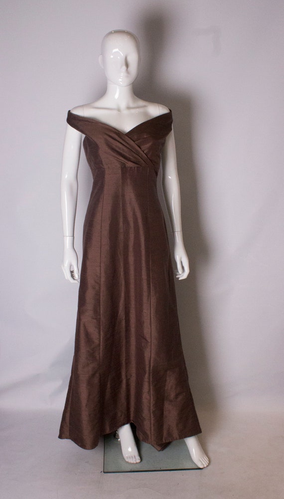 A vintage 1980s brown gown with train