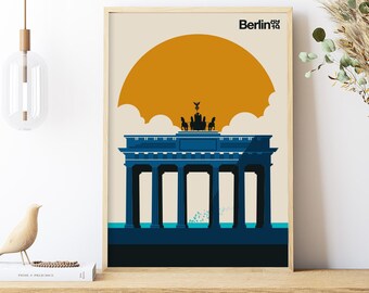 May include: A minimalist poster with a blue silhouette of the Brandenburg Gate in Berlin, Germany. The gate is set against a yellow sun and a light blue sky. The text "Berlin" is in black at the top of the poster.