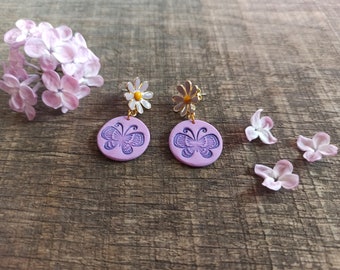 Butterflies with delicate flowers in lavender purple as earrings