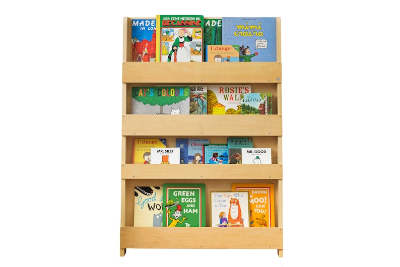 May include: A wooden bookshelf with four shelves, filled with colorful children's books. The books have titles like "Green Eggs and Ham", "Rosie's Walk", and "Mr. Silly".