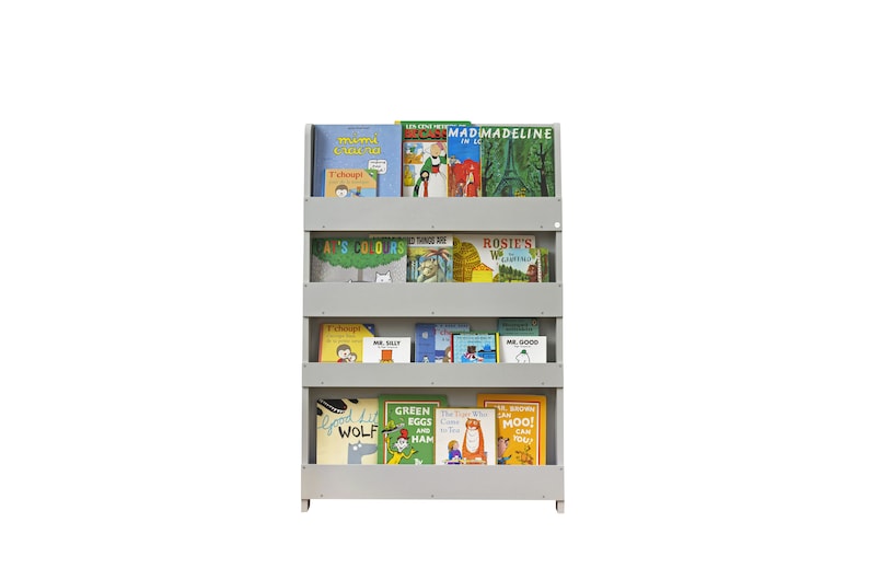 May include: A gray wooden bookshelf with four shelves filled with children's books. The books have colorful covers with various illustrations and titles such as "Green Eggs and Ham", "The Very Hungry Caterpillar", "Madeline", and "Mr. Silly".