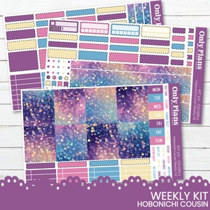 May include: A weekly planner sticker kit designed for the Hobonichi Cousin planner. The kit features a purple, blue and yellow colour scheme with a sparkly background. The stickers include boxes, banners and a variety of other designs.