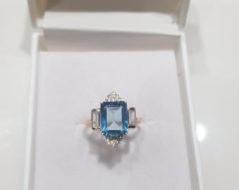 14k Yellow Gold Emerald Cut Blue Topaz Ring with Cubic Zirconia