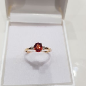 14k solid yellow gold AAA quality a kind of unique oval shaped orange sapphire and natural round brilliant cut shaped diamonds ring