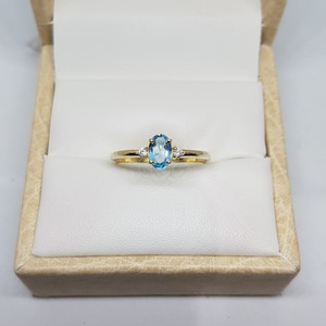14k solid yellow gold natural oval shaped blue topaz gemstone and natural round brilliant cut shaped diamonds gemstones ring