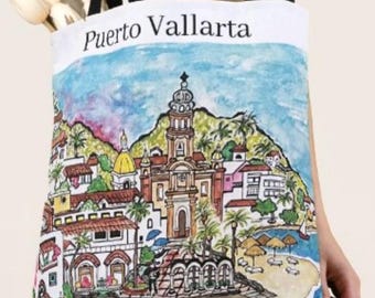May include: A white tote bag with a colorful illustration of a cityscape with a church and palm trees. The text "Puerto Vallarta" is printed in black at the top of the bag.