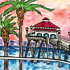 May include: A watercolor painting of a pier with a red roofed building on top. Two palm trees are in the foreground with a blue ocean and pink sky in the background.