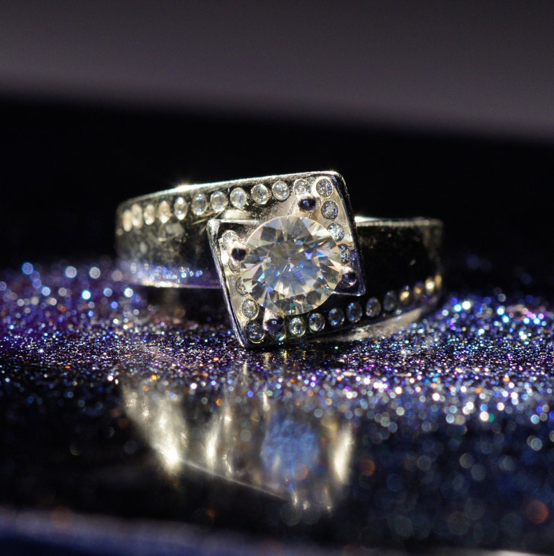 with bezel set cubic zirconia accents, 5.6mm.7 Carat Pure White Moissanite VVS1 in 925 Silver E-F Color Range