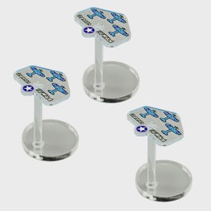 May include: Three miniature airplane models on clear stands. Each model has a light blue and white design with the text "Grumman F4F Wildcat" and a star emblem. The stands have a circular base.