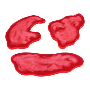 May include: Three red acrylic shapes, each with a unique organic form. The shapes are smooth and translucent, with a slight marbling effect.