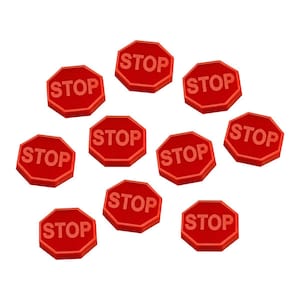 May include: Ten red octagonal stop signs with white lettering. Each sign reads "STOP" in all caps.