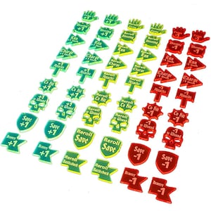 May include: A set of 30 acrylic tokens for a tabletop game. The tokens are in three colors: green, yellow, and red. Each token has a different symbol and text, such as "Reroll Save", "Run 1 inch", and "Co Fit +1".