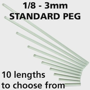 May include: Clear, cylindrical standard pegs in 10 lengths, ranging from 1/8 to 3mm. The text on the image reads "1/8 - 3mm STANDARD PEG" and "10 lengths to choose from".