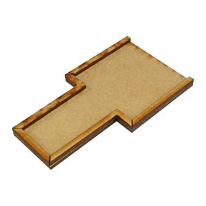 May include: A wooden T-shaped game board with a brown stain. The board has a raised edge around the perimeter.