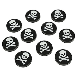 May include: Ten black and white skull and crossbones round buttons. The buttons are approximately 1 inch in diameter.