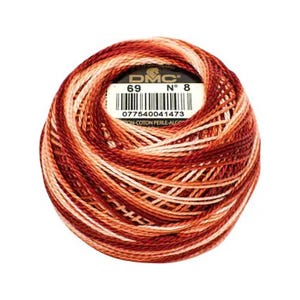 May include: A ball of DMC brand embroidery floss in shades of red, orange, and cream. The label shows the number 69 and No. 8, along with a barcode and the text "ON-COTON PERLE-ALGODON". The thread is tightly wound.