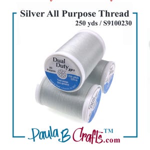 May include: Three spools of silver all-purpose thread are displayed against a white background. The spools are labeled "Dual Duty XP" and contain 250 yards of thread. The image also includes the text "Paula B Crafts.com" and "Coats & Clark."