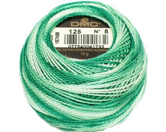 May include: A skein of DMC embroidery floss in color 125, a green and white ombre. The label reads "DMC N° 8 125 077540041732 ARL COTTON-COTON PERLE-ALGODON 10 g".