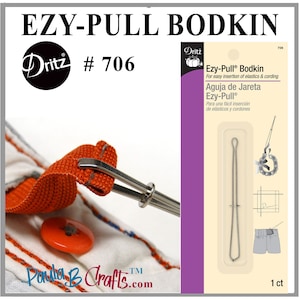 May include: A silver Ezy-Pull Bodkin sewing tool for easy insertion of elastics and cording. The tool is packaged in a clear plastic sleeve with a pink and white label. The label includes the Dritz brand name, product number 706, and instructions in both English and Spanish.