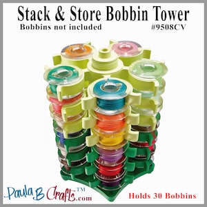 May include: Green and yellow plastic bobbin tower that holds 30 bobbins. The tower is shaped like a star and has a rotating top. The text "Stack & Store Bobbin Tower" and "#9508CV" is printed on the top of the tower. The text "Paula B Crafts.com" and "Holds 30 Bobbins" is printed on the bottom of the tower.