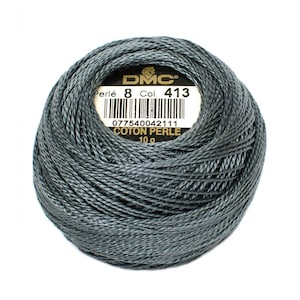 May include: A ball of DMC Perle Cotton embroidery floss in color 413, a dark gray shade. The label reads "Perle 8 Col. 413" and "COTON PERLE 10g".