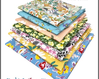 May include: A stack of ten-inch by ten-inch 100% cotton fabric squares in various floral patterns. The fabrics feature designs in shades of blue, yellow, pink, green, and peach. The text "PBC2020FS / 10" X 10" 100% Cotton" is visible.