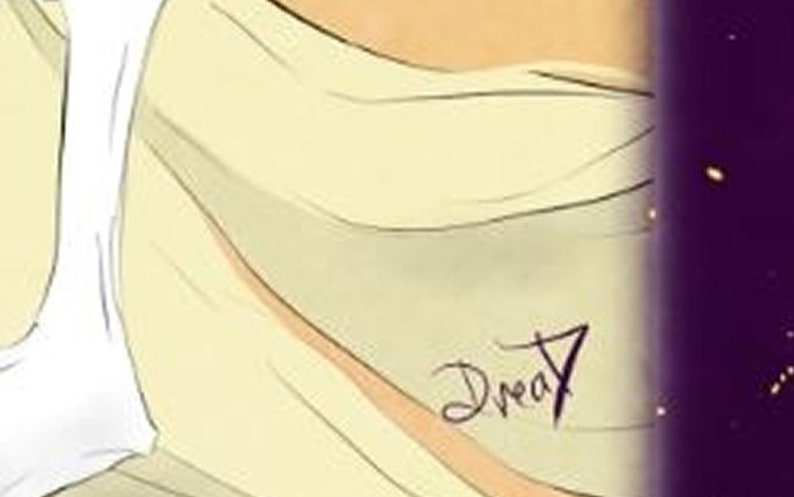 May include: A close-up of a light yellow fabric with the word "Dream" written in black ink.