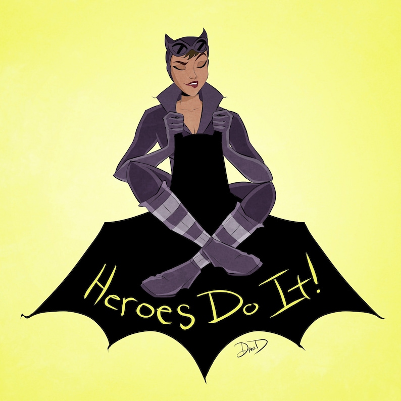 May include: A woman dressed as Catwoman sits on a black bat symbol with the text "Heroes Do It!" in yellow. She is wearing a black catsuit with a purple and white striped pattern on her legs.